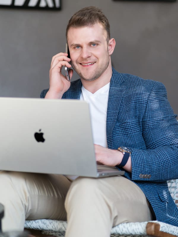 Jan Buchal holding a phone