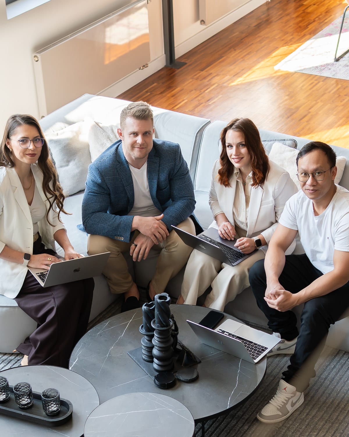 The ThriveAds team collaborating around a laptop