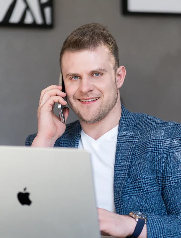 Jan Buchal holding a phone